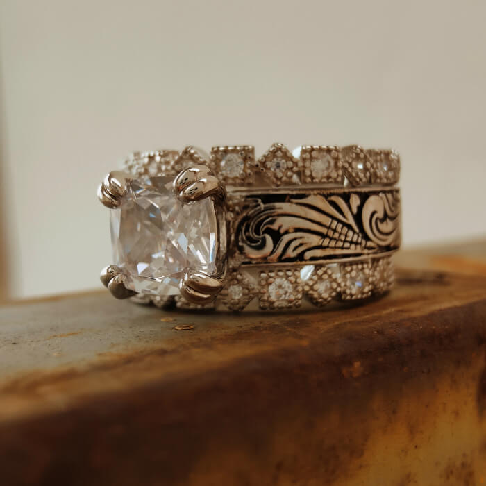 Vintage Western diamond engagement ring with intricate silver band design