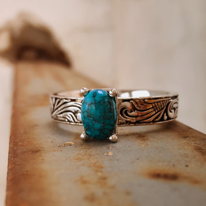Flower engraved silver ring with turquoise stone, elegant Western jewelry.