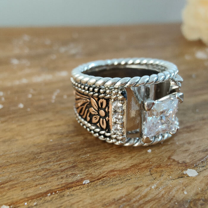 Sterling silver twist band engagement ring with square diamond and flower design
