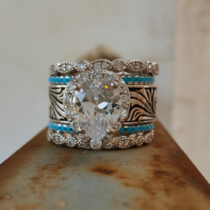 Five-piece turquoise and diamond wedding ring set with pear-cut center stone