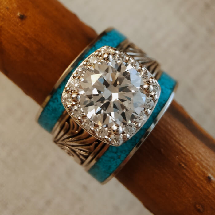 3pc Western turquoise and diamond ring set on a wooden surface