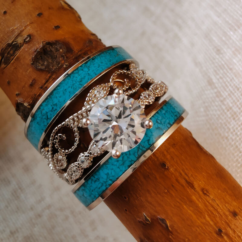 Sterling silver engagement ring set with round moissanite and turquoise accents.