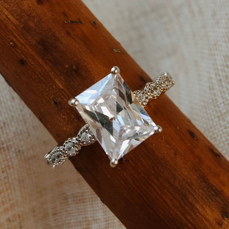 Sterling silver moissanite wedding ring with square cut stone.