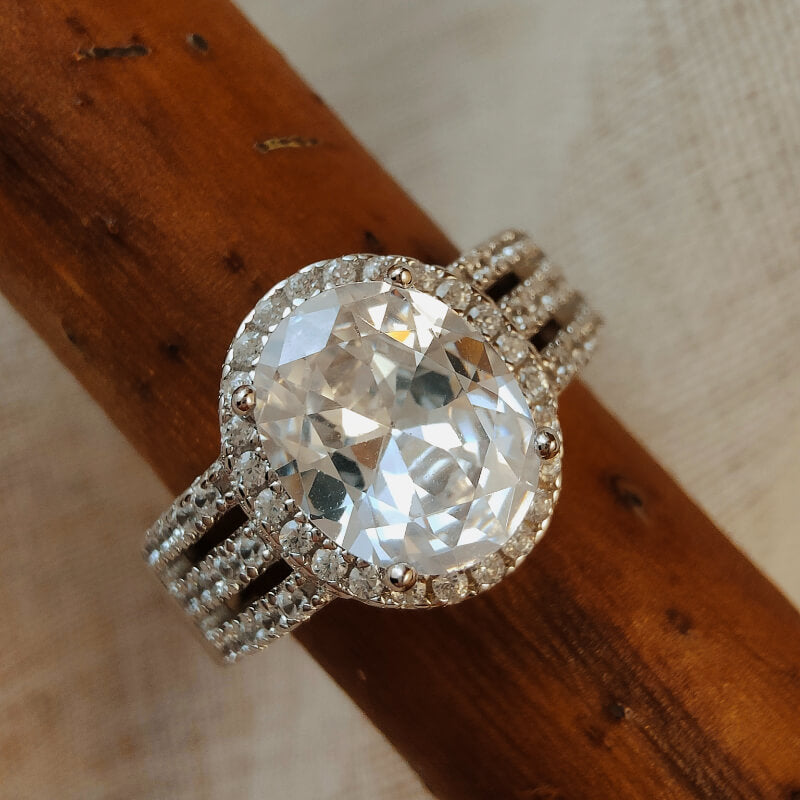 Sterling silver oval cut moissanite wedding ring set with diamond accents