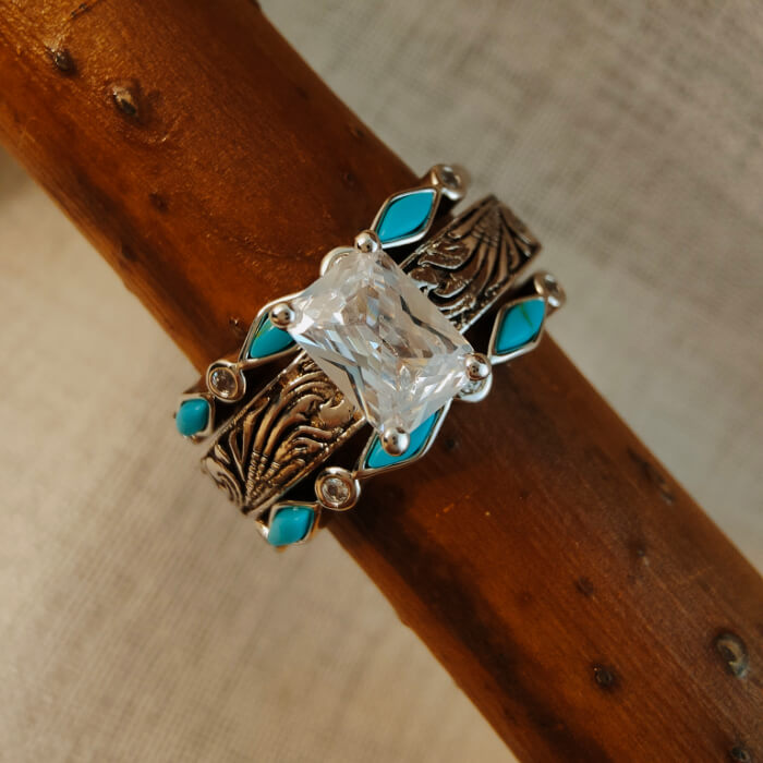 Sterling silver women's ring with turquoise and a large diamond-like center stone