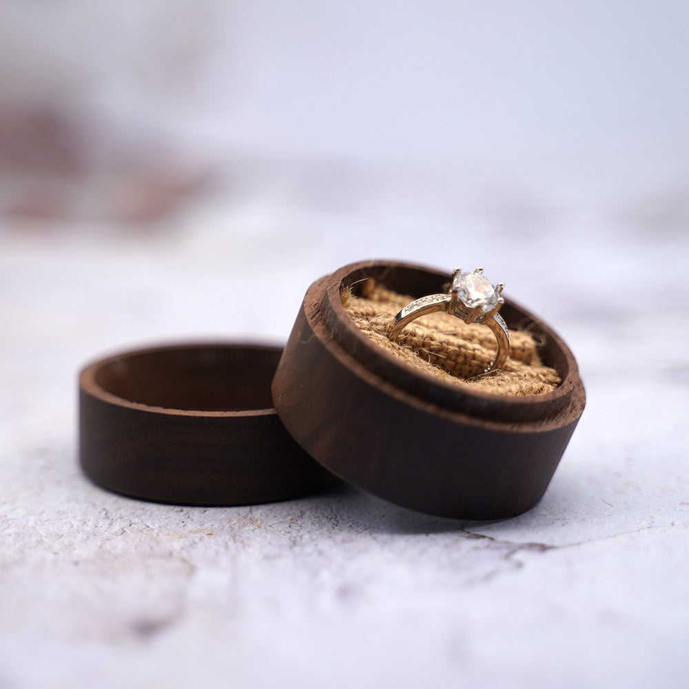 Dark walnut Forever Love gift box with an engagement ring inside