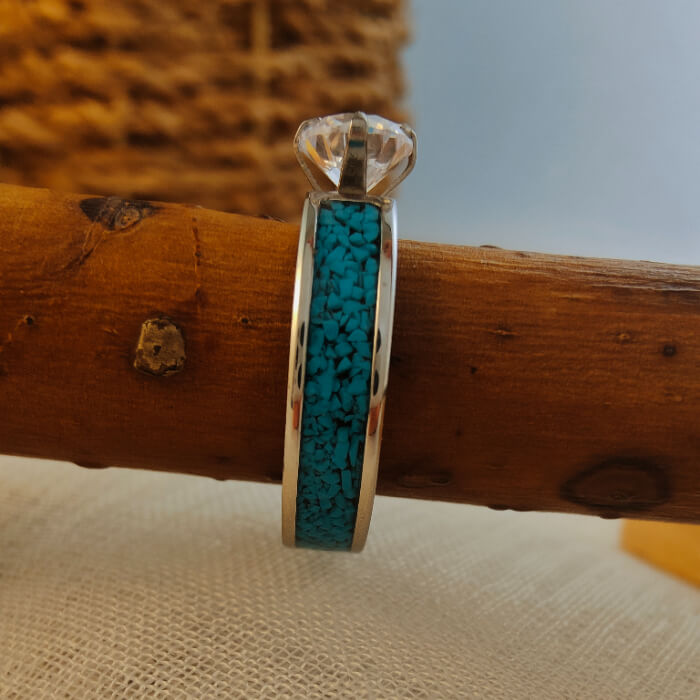 Steel wedding ring featuring blue crush turquoise and zircon stone