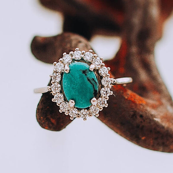 Sterling Silver Oval Cut Turquoise Engagement Ring with Diamond Halo