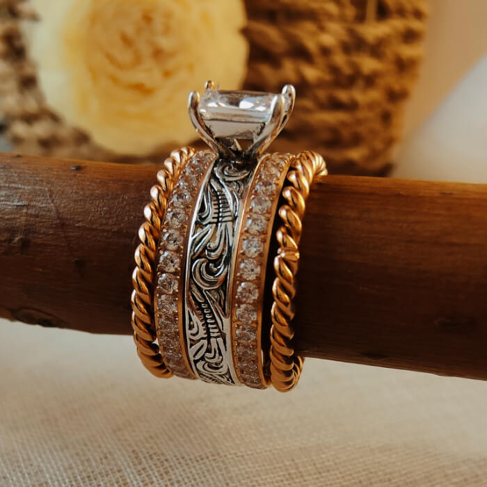 Rose gold and silver engagement ring set with zircon and intricate engravings