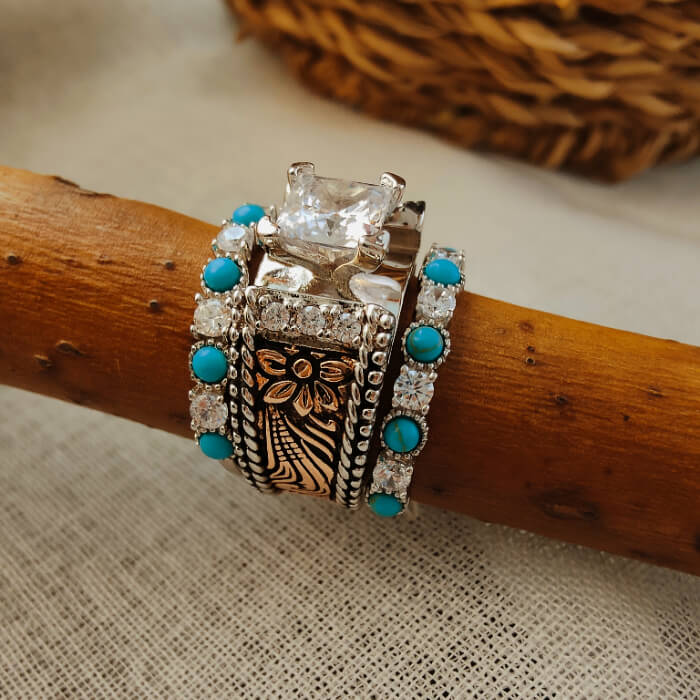 Three-piece turquoise and moissanite engagement ring set with floral design