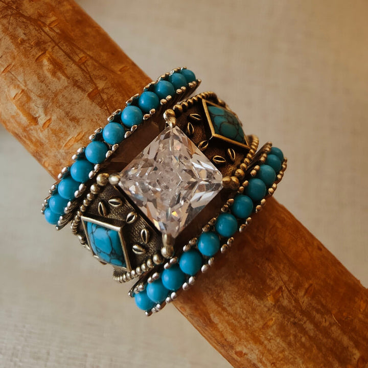 Sterling silver turquoise ring set with square zircon and bead accents