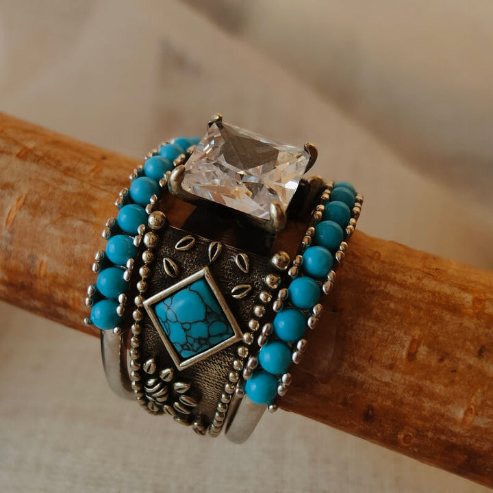 Sterling silver turquoise ring set with large zircon and small turquoise beads.