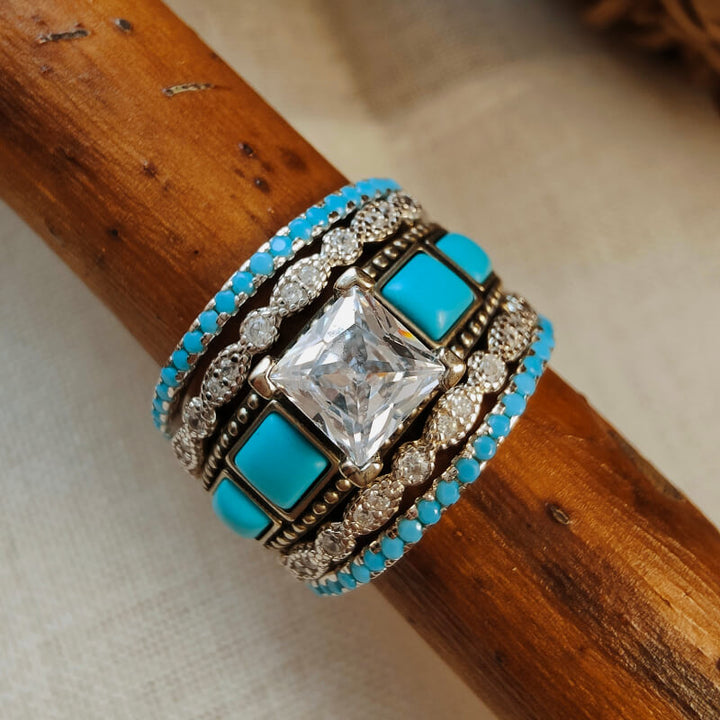 Vintage turquoise and zircon ring set with detailed silver accents