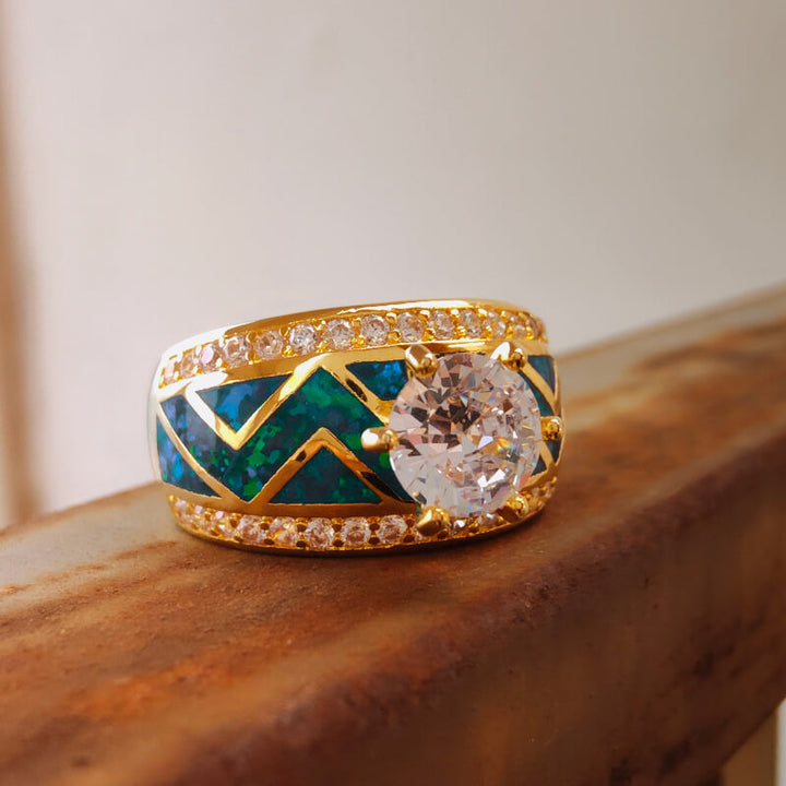 Geometric blue opal diamond engagement ring with large center diamond and gold band