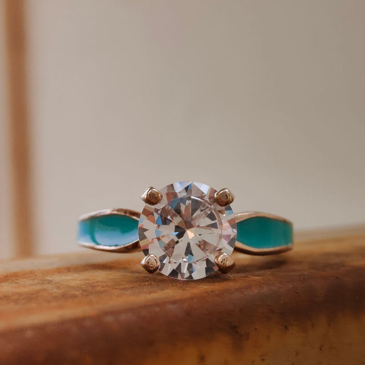 Sterling silver round cut moissanite engagement ring with turquoise accents