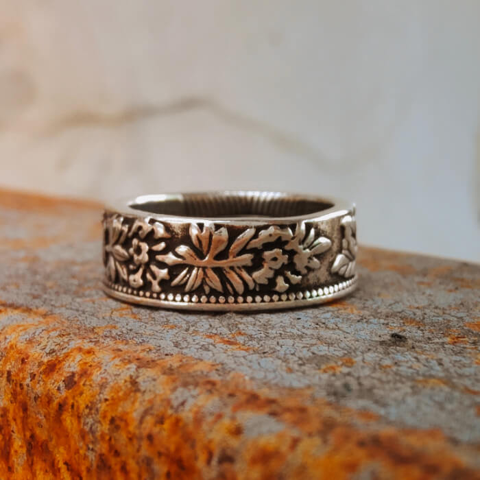Intricate floral engraved 6mm steel Western band ring for men.