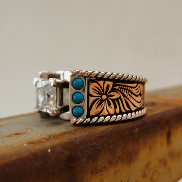 Western turquoise and diamond ring with floral design and silver accents