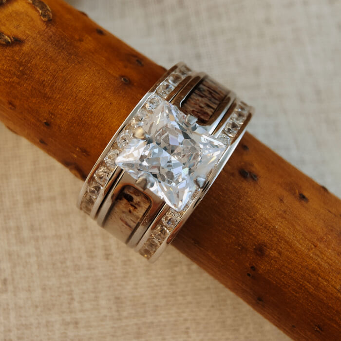 Antler Square Diamond Ring with princess-cut diamond on rustic wooden branch