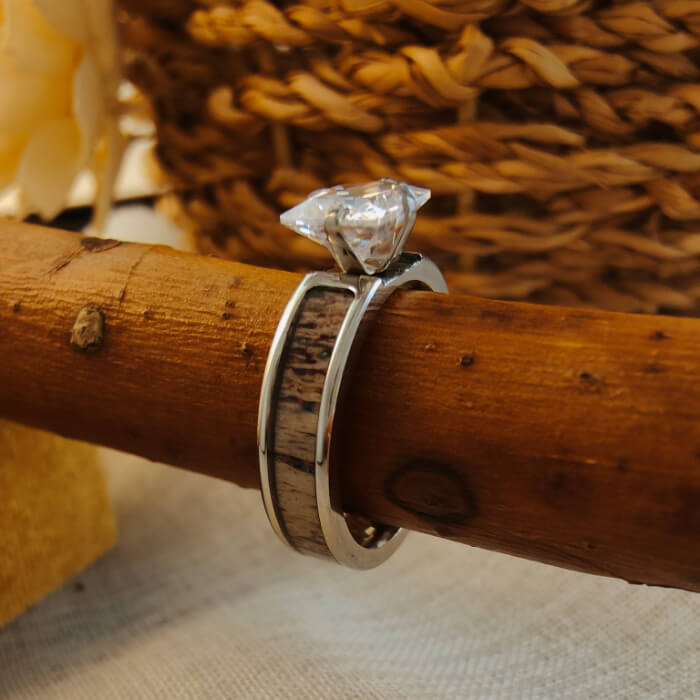 Antler Square Diamond Ring with princess-cut diamond on rustic wooden branch