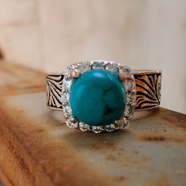 Flower engraved turquoise ring with diamond halo and silver-black band