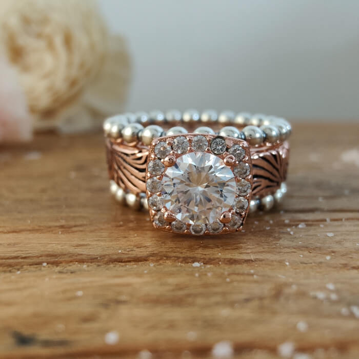 Rose gold and silver bead ring set featuring large round moissanite stone