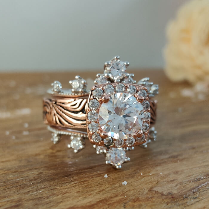Ornate rose gold engagement ring with large center zircon and sparkling accents