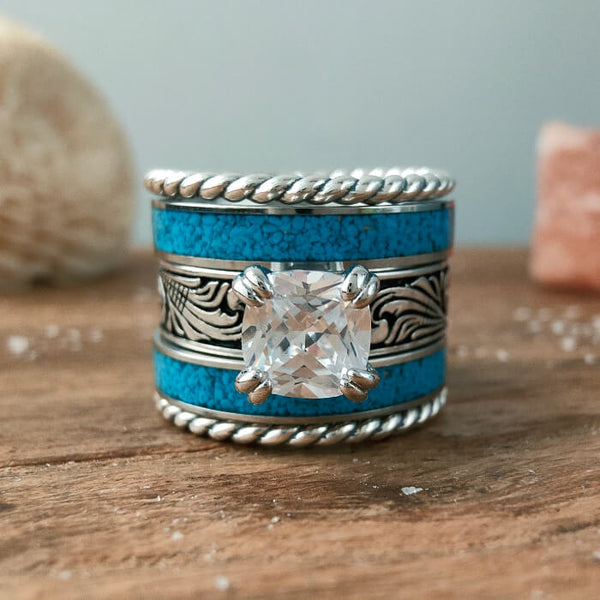 Turquoise wedding ring set with clear stone and floral engraving