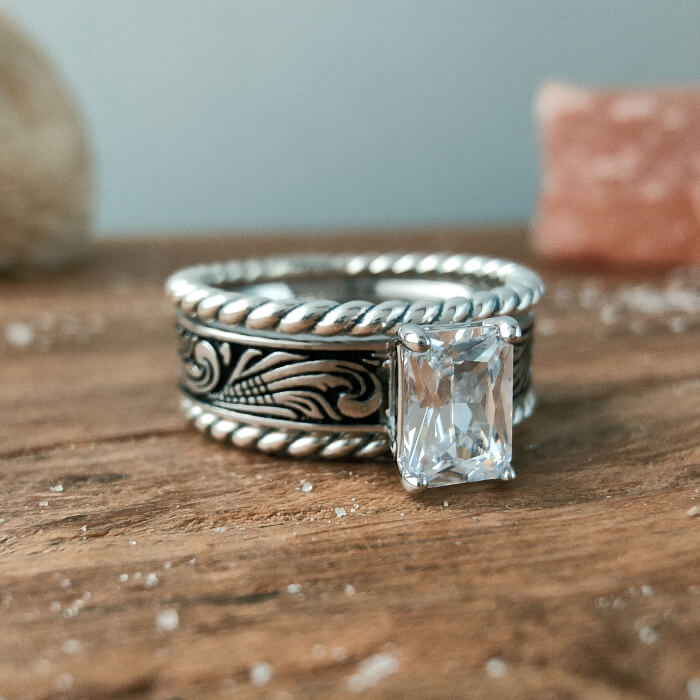 Sterling silver twist band ring with rectangular zircon and engraved floral pattern