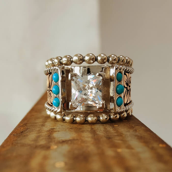 Western engagement ring with square diamond and turquoise accents