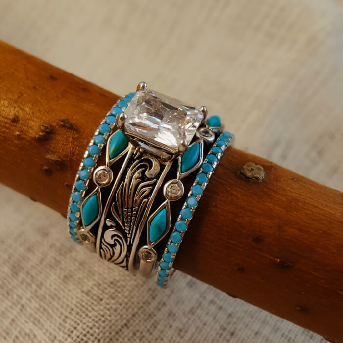 Vintage wedding ring set with emerald cut stone and turquoise accents.