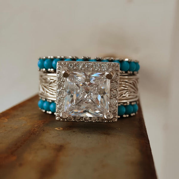 Princess cut diamond ring with turquoise beads and silver detailing