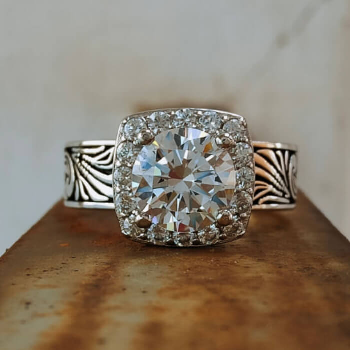 Western engagement ring with cubic zirconia surrounded by a diamond halo
