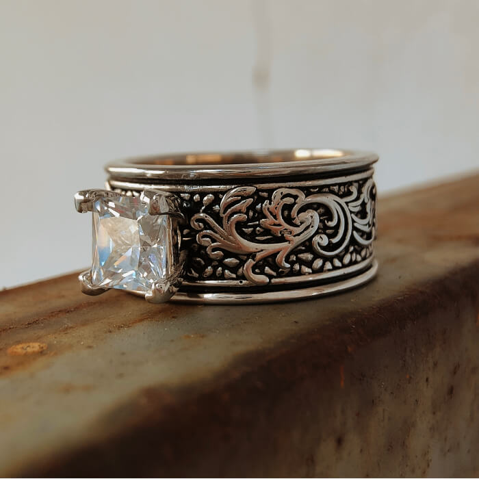 Western silver band ring with intricate floral carvings and large square zircon