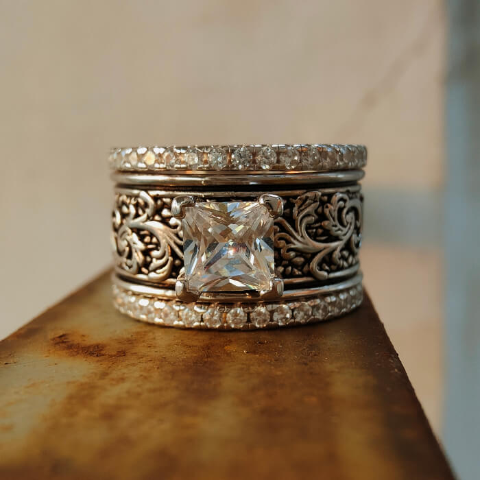 Western engagement ring set with flower engravings and large center zircon