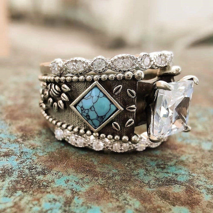 Western engagement ring with square turquoise and zircon on an engraved copper band