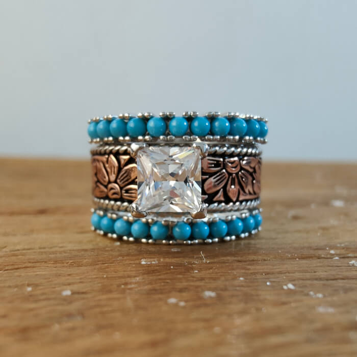 Rose gold princess cut ring with turquoise beads and floral engravings