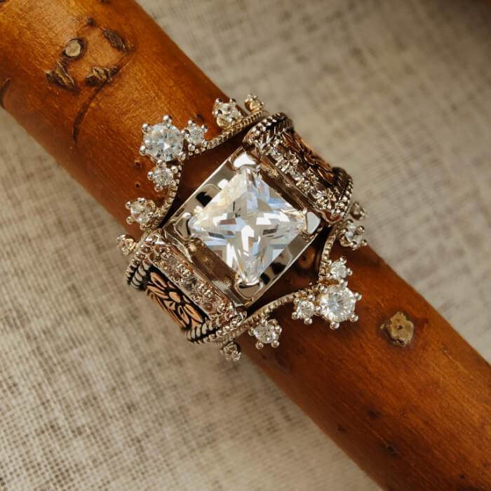 Vintage square zircon ring with floral engravings and diamond accents