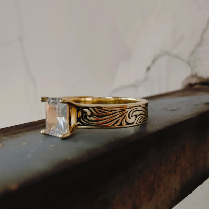 14K gold ring with rectangular zircon and intricate floral engravings