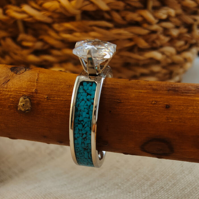 Silver wedding ring with turquoise inlay and clear princess cut zircon stone.