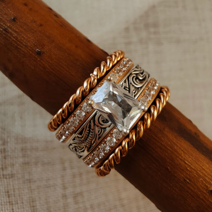 Rose gold and silver engagement ring set with zircon stone and engravings