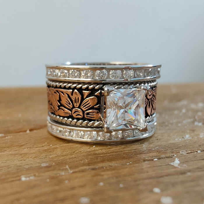 Floral engraved Western-style ring with princess cut stone and diamond accents