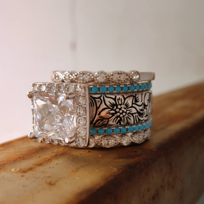 Engagement ring with princess cut zircon and turquoise floral engravings
