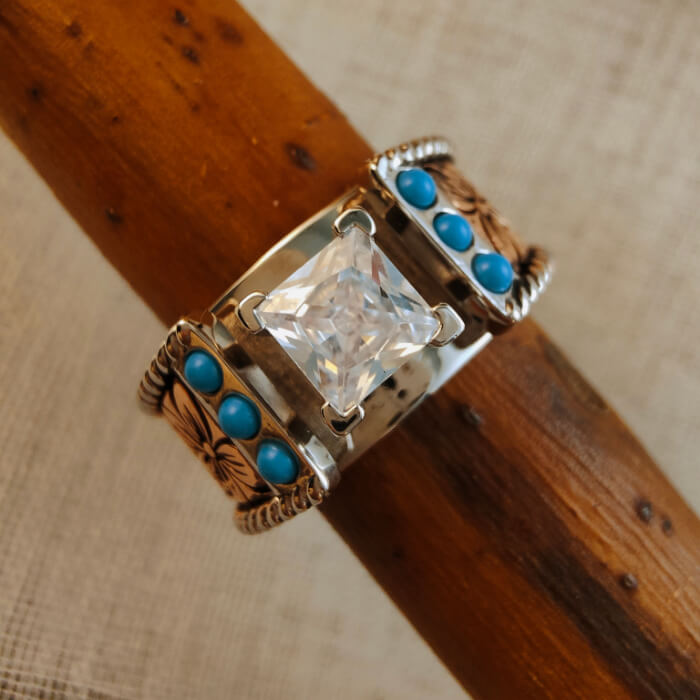 Rose gold square diamond engagement ring with turquoise accents and floral engravings.