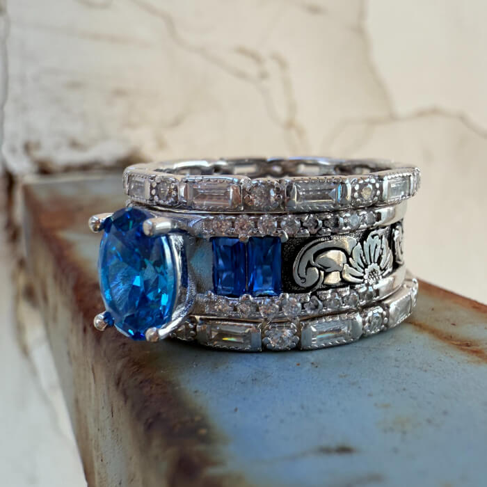 Vintage oval sapphire diamond engagement ring on a rusty surface