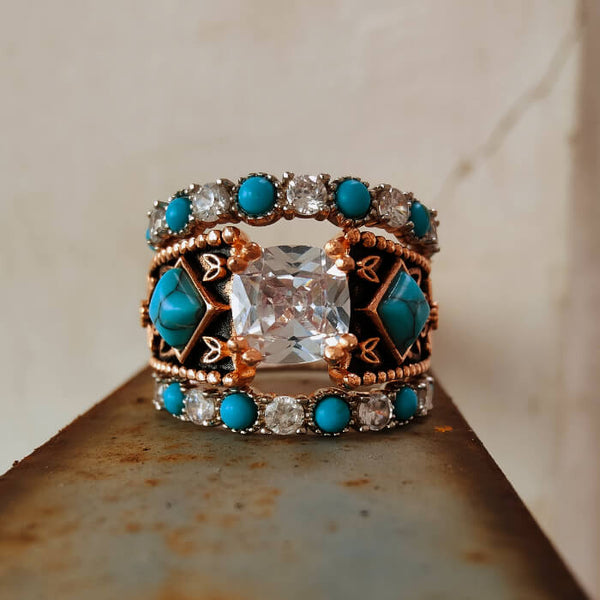 Rose gold turquoise and diamond ring with a large center stone