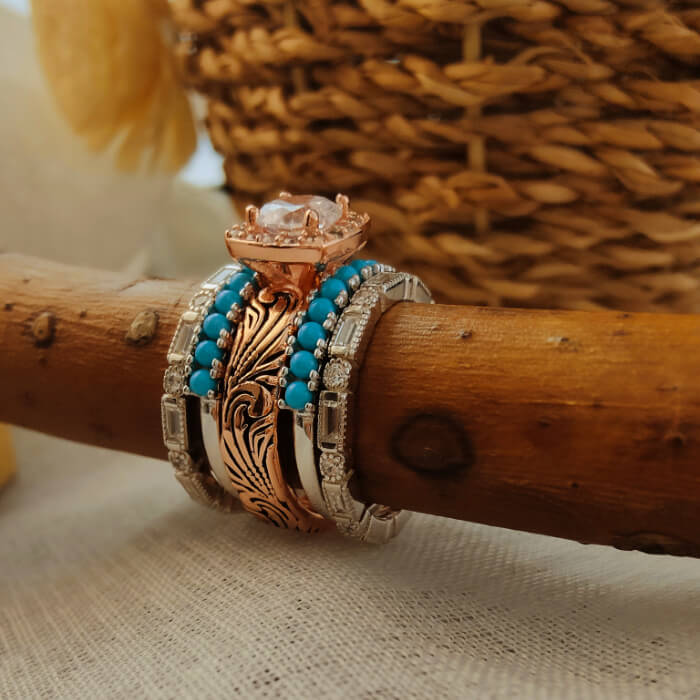 Five vintage wedding rings in rose gold and silver with turquoise and moissanite accents.