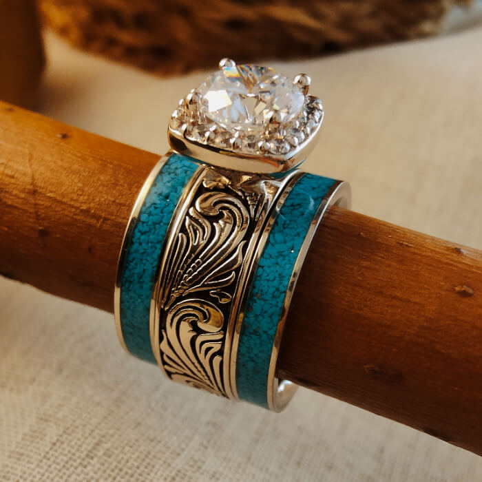Western turquoise and diamond ring set with detailed engravings and a sparkling center stone