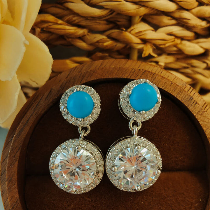 Polished oxidized turquoise and diamond drop earrings with round zircon accents.
