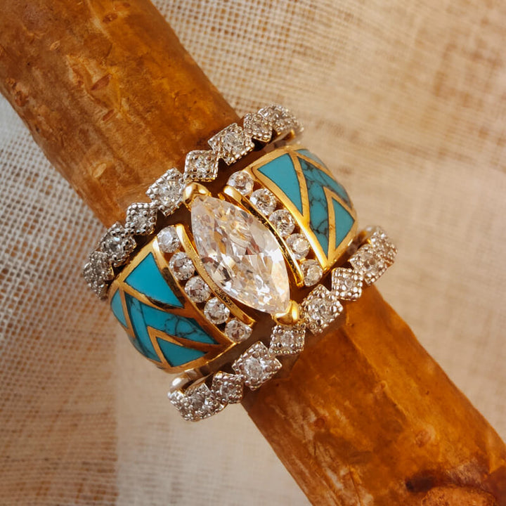 Sterling silver turquoise ring set with marquise cut stone and diamond accents