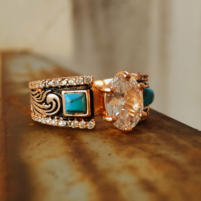 Rose gold wide band engagement ring with oval zircon and turquoise accent stones